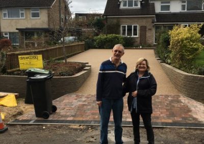 Two customers, delighted with their home improvement