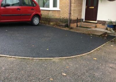 A driveway imrpoved with new tarmac