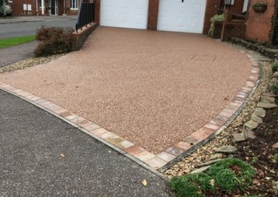 A lovely curved resin driveway leading to a customer's double garage in Honiton, Devon