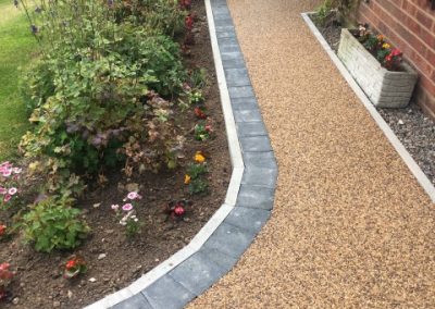 An attractive curved pathway to border the front garden