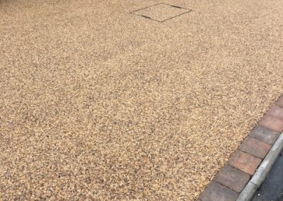 Resin bound recess cover and mixed block paving border