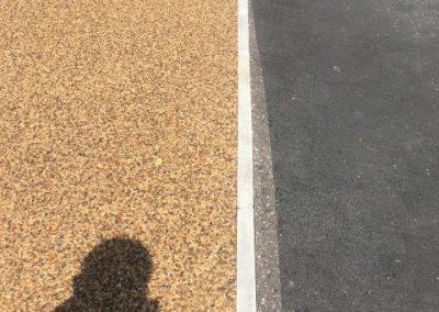 Flat-top kerbing, separating the driveway from the pavement