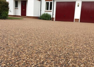 Barely visible crushed glass is added to most resin driveways, to provide an anti-slip surface