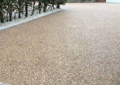 Freshly laid resin, complimented by some expertly laid block paving