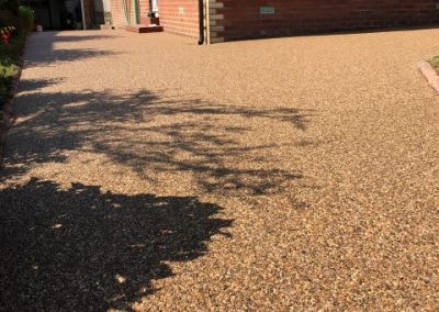 Resin bound permeable surfacing