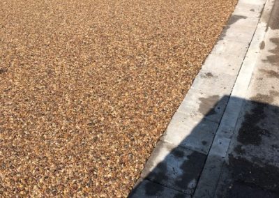 Autumn Gold resin bound surface outlined by block paving